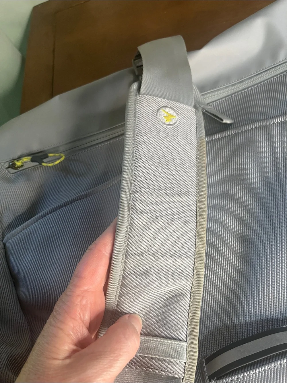 Marmot Light Gray Roll-Top Laptop Messenger Bag with Yellow Accents